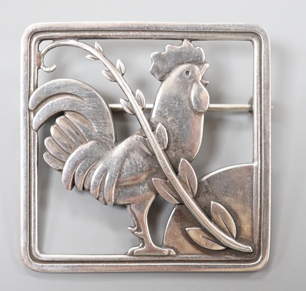 A Georg Jensen sterling 'cockerel and frond' square brooch, no. 276, 37mm.